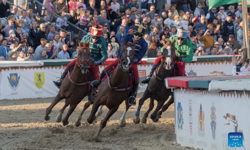 Nikolett Szabo (C) of Hungary competes during the final of the National Gallop equestrian festival in Budapest, Hungary, on Oct. 3, 2021. (Photo by Attila Volgyi/Xinhua)