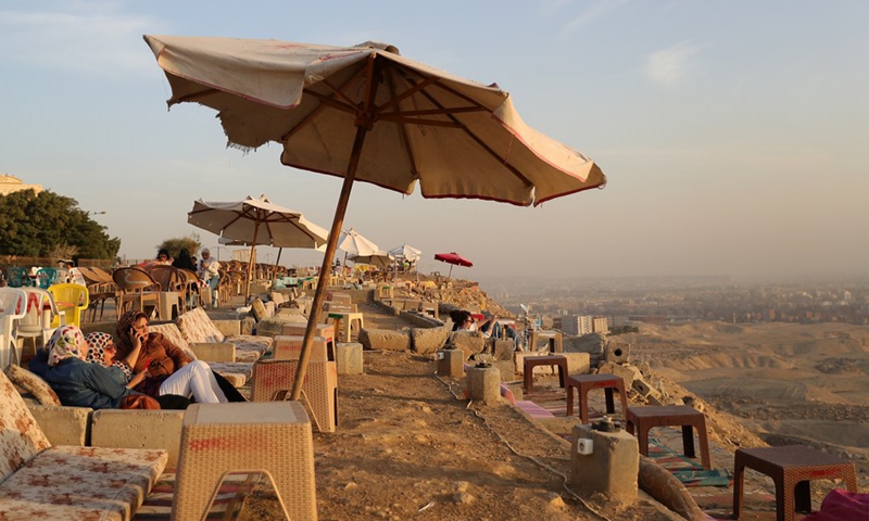 Tourists enjoy the sunset glow at the Mokattam Corniche in Cairo, Egypt, on Oct. 17, 2021.(Photo: Xinhua)