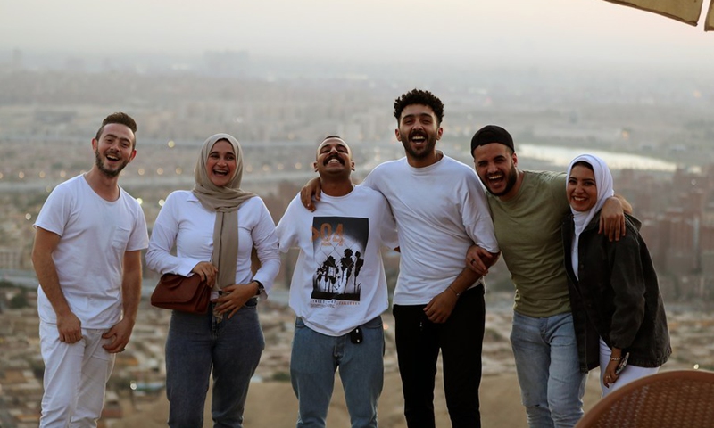 Tourists enjoy the sunset glow at the Mokattam Corniche in Cairo, Egypt, on Oct. 17, 2021.(Photo: Xinhua)