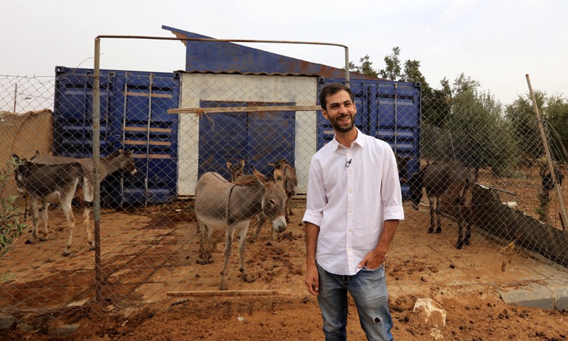 Emad Attiyat is seen at his farm where he keeps 13 donkeys on the outskirts of Madaba, Jordan, on Oct. 13, 2021.(Photo: Xinhua)