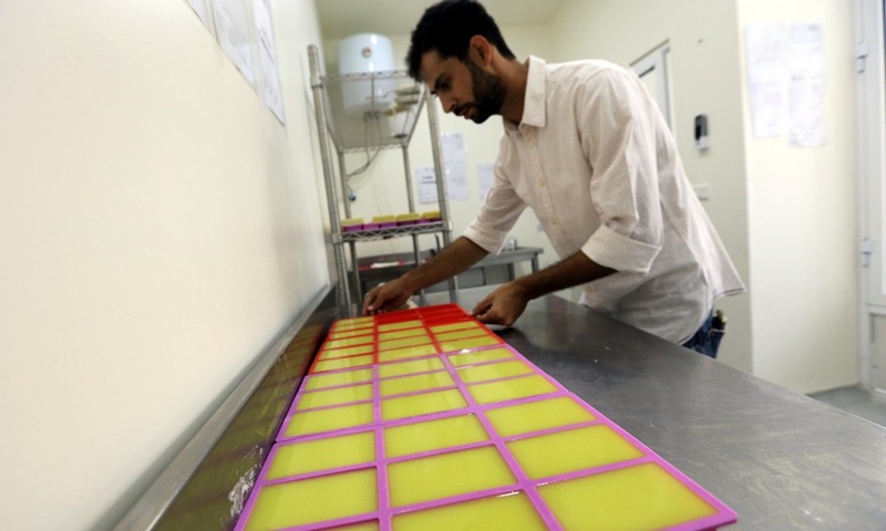 Emad Attiyat makes soaps from donkey milk at a workshop in Amman, Jordan, on Oct. 13, 2021(Photo: Xinhua)