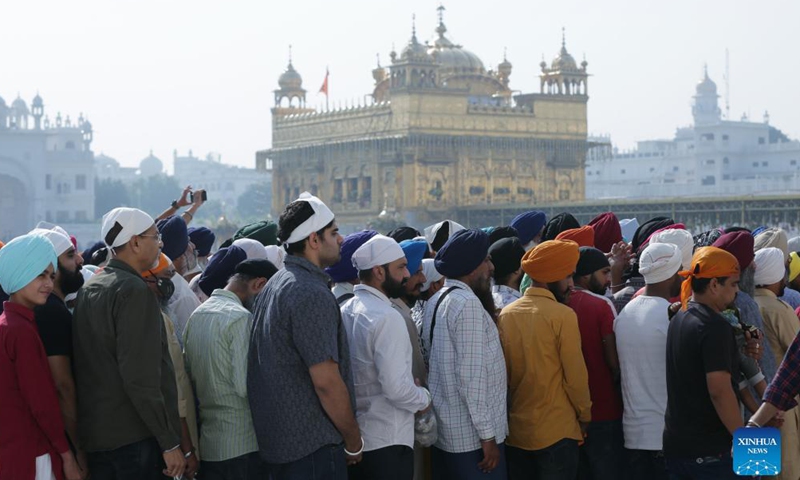 Devotees wait in queues to visit the Golden Temple, the holiest of Sikh shrines, on the occasion of the birth anniversary of the fourth Sikh Guru in Amritsar of India's northern state of Punjab, Oct. 22, 2021.Photo:Xinhua