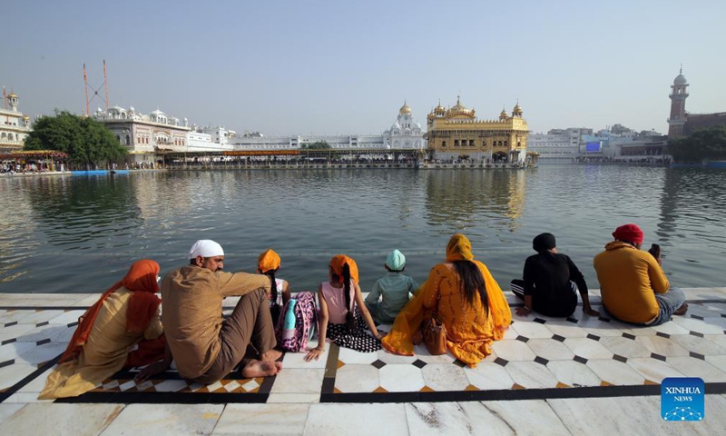 Devotees visit the Golden Temple, the holiest of Sikh shrines, on the occasion of the birth anniversary of the fourth Sikh Guru in Amritsar of India's northern state of Punjab, Oct. 22, 2021.Photo:Xinhua