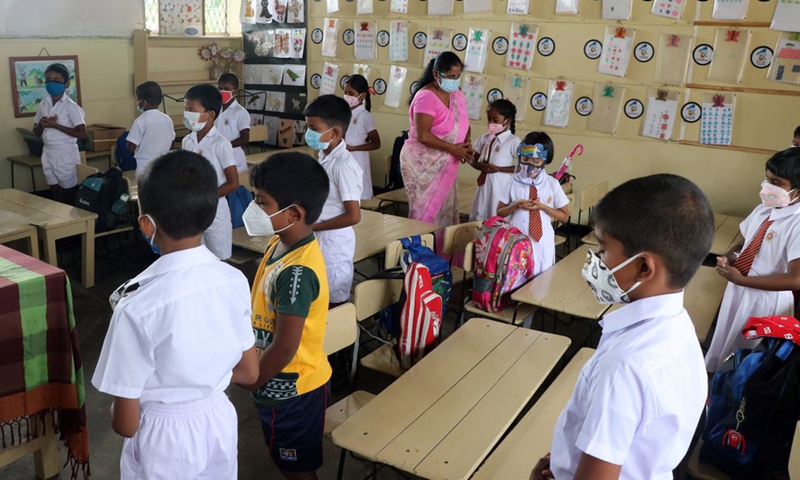 Students wearing face masks are seen at a primary school in Colombo, Sri Lanka, Oct. 25, 2021.(Photo: Xinhua)