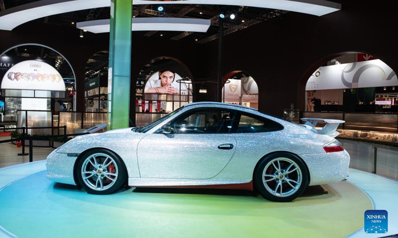 Photo taken on Nov. 5, 2021 shows a Porsche sports car decorated with gems at the Consumer Goods Exhibition Area of the 4th China International Import Expo (CIIE) in east China's Shanghai. The Porsche car is decorated with nearly 400,000 gems, which were made by craftsmen by hand for several months.Photo:Xinhua