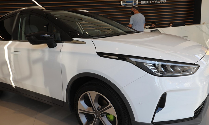 Israeli people are seen at a car company as they check out an electric car made by China's Geely Auto in Tel Aviv, Israel on Nov. 10, 2021.(Photo: Xinhua)