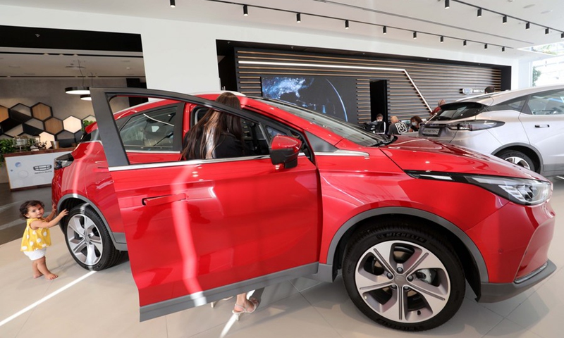 Israeli people are seen at a car company as they check out an electric car made by China's Geely Auto in Tel Aviv, Israel on Nov. 10, 2021.(Photo: Xinhua)