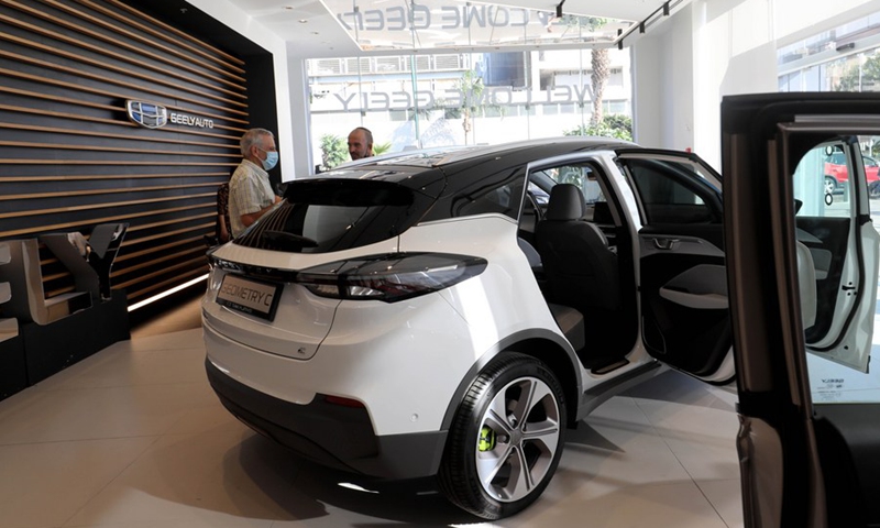 Israeli people are seen at a car company as they check out an electric car made by China's Geely Auto in Tel Aviv, Israel on Nov. 10, 2021.(Photo: Xinhua)