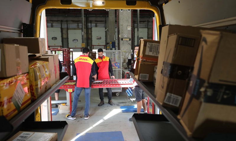 Israeli workers work at the DHL sorting center in the Airport City near the central Israeli city of Tel Aviv on Nov. 11, 2021. (Photo: Xinhua)