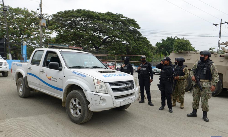 Police officers stand guard outside the Litoral Penitentiary after clashes occurred in the prison in Guayaquil, Ecuador, Nov. 13, 2021.Photo:Xinhua