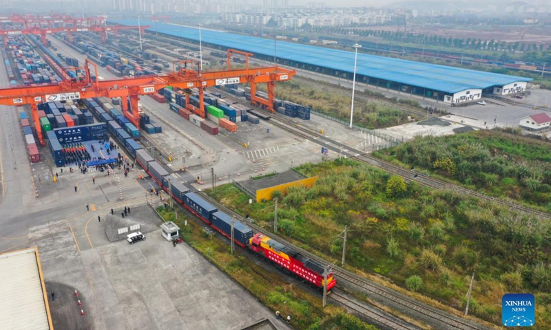 Aerial photo shows a freight train bound for Lao capital Vientiane departing from southwest China's Chongqing, Dec. 4, 2021.Photo:Xinhua