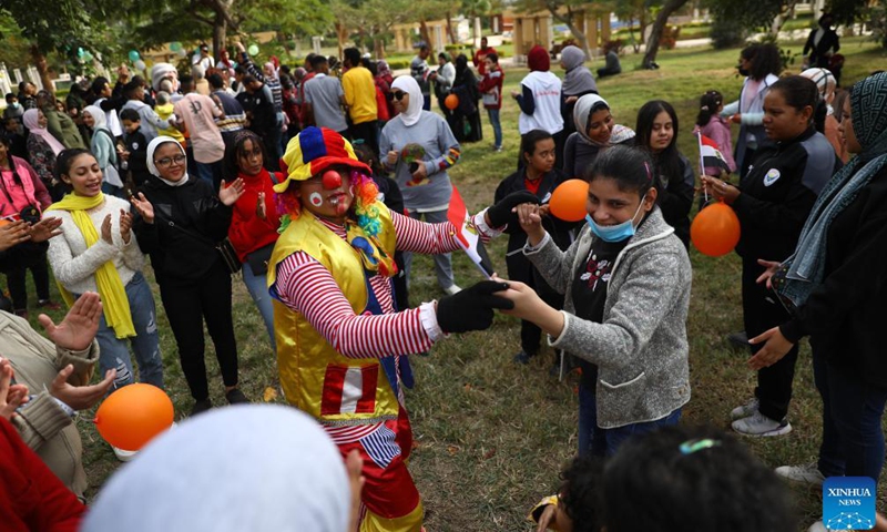 A clown interacts with a woman during a gathering to mark the International Day of Persons with Disabilities at Merryland Park in Cairo, Egypt, on Dec. 3, 2021.Photo:Xinhua