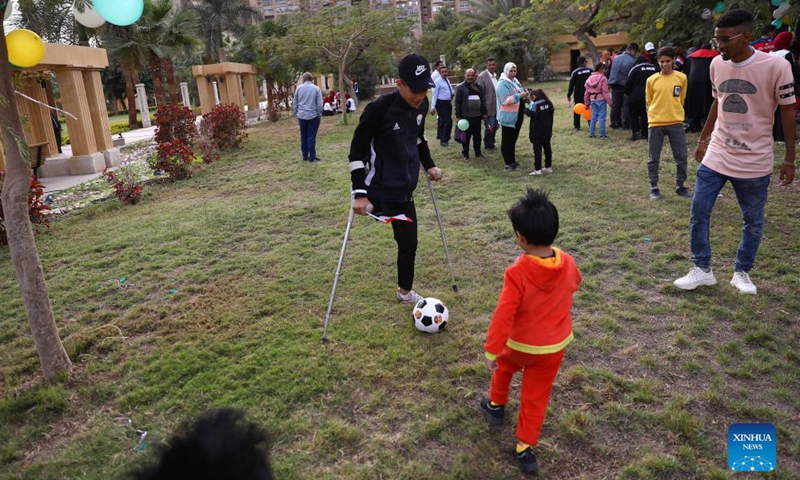 A boy plays football during a gathering to mark the International Day of Persons with Disabilities at Merryland Park in Cairo, Egypt, on Dec. 3, 2021.Photo:Xinhua