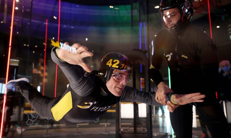 An Israeli man practices indoor skydiving in a wind tunnel in Rishon Lezion, Israel, Dec. 9, 2021.(Photo: Xinhua)