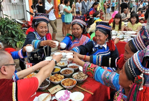 People celebrate twins festival in SW China's Yunnan Province - Global ...