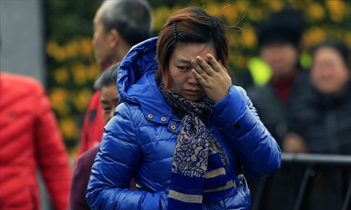 Relatives mourn for victims of Shanghai New Year's Eve stampede ...