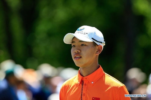 China's Guan Tianlang at Par 3 Contest for 2013 Masters - Global Times