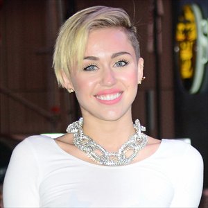 miley cyrus grabs top slot in uk single and album charts