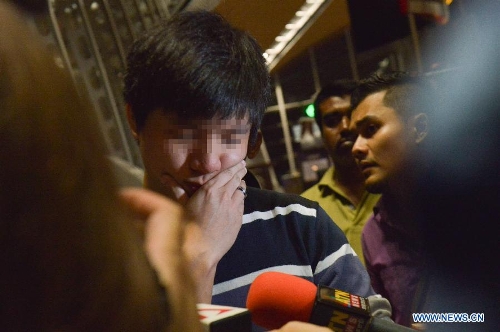 Relatives of passengers of crashed Malaysian plane wait at Kuala Lumpur ...