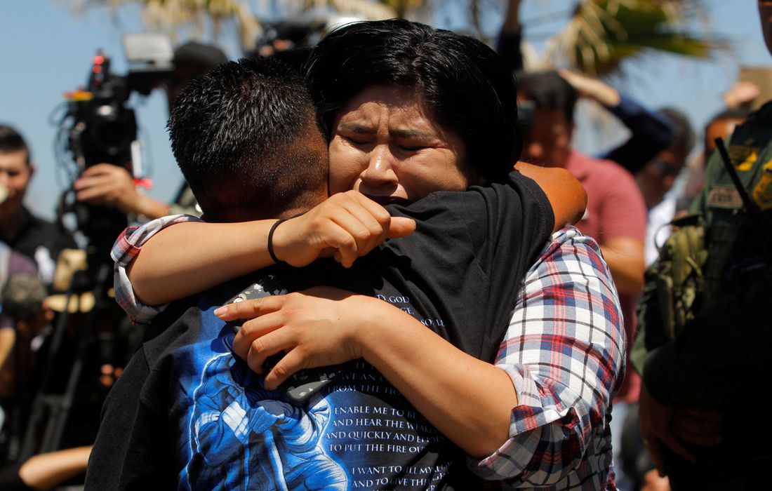 Family before fences: US Border patrol agents open a single gate to ...