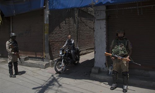 Indian paramilitary troopers stand guard during security lockdown in ...