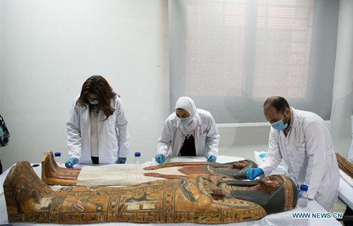 Archaeologists unpacks two ancient sarcophagi with mummies inside in ...