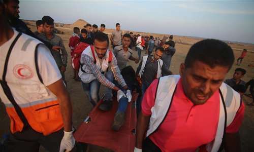 Clashes between Palestinian protesters and Israeli troops break out on ...