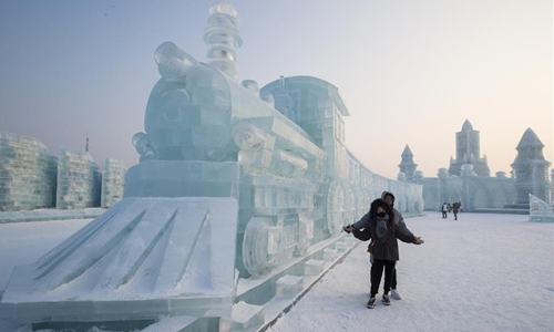 Tourists enjoy ice sculptures at Harbin Ice-Snow World in NE China's ...