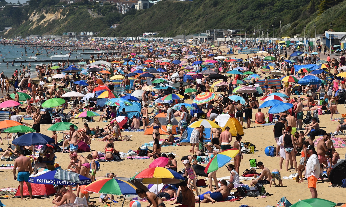 Virus Warning As Britons Flock To The Beach Global Times