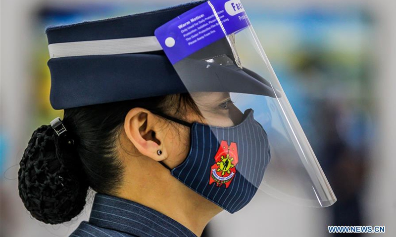 Police officers wear face shield amid COVID-19 outbreak in ...