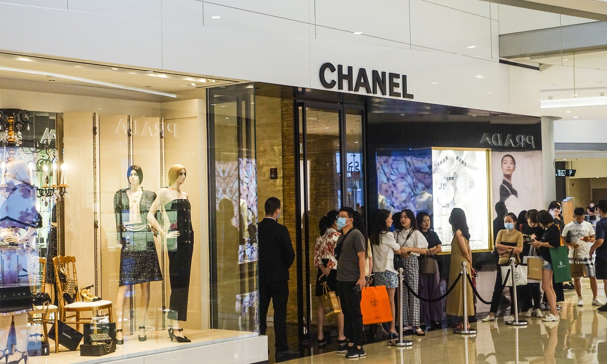 PARIS-APR 15: Customers Are On Queue To Enter Louis Vuitton Shop