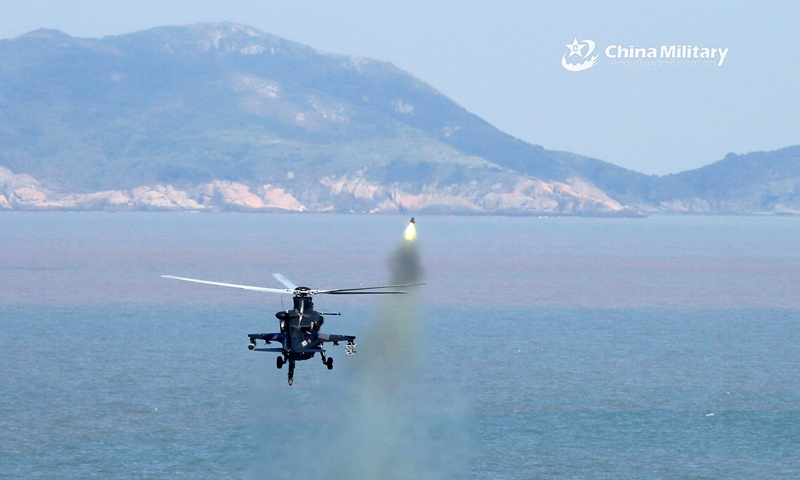 An attack helicopter attached to an army aviation brigade under the PLA 72nd Group Army fires rocket at a simulated target on the island during a fire strike training exercise in late September, 2020. (eng.chinamil.com.cn/Photo by Zhang Huanpeng)