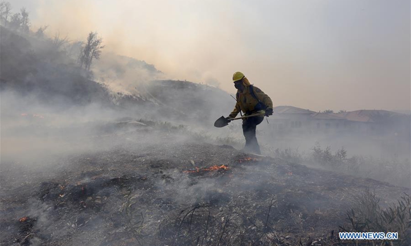 Raging wildfires injure two firefighters in California, force massive ...