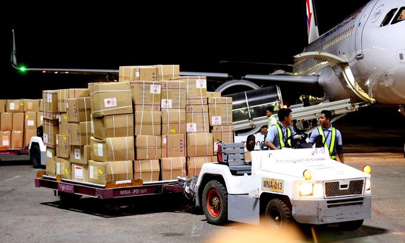 Workers unload protective equipment donated by Chinese government at the Yangon International Airport in Yangon, Myanmar, March 27, 2020.File photo:Xinhua