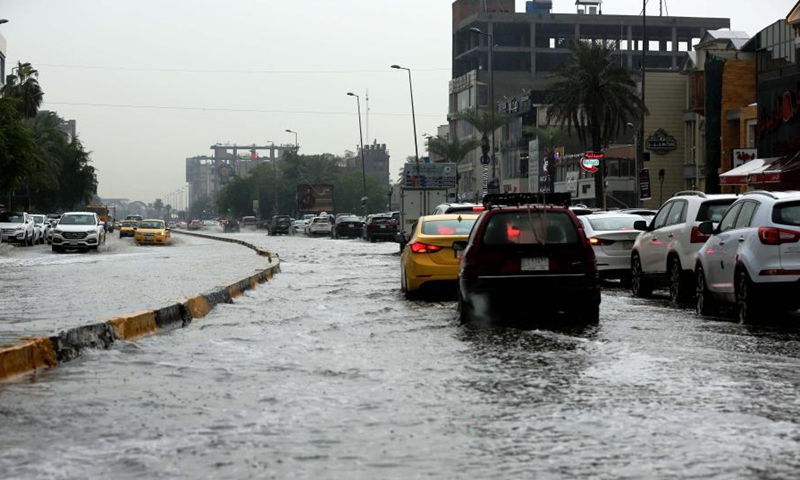 Vehicles run on flooded roads in Baghdad, Iraq - Global Times