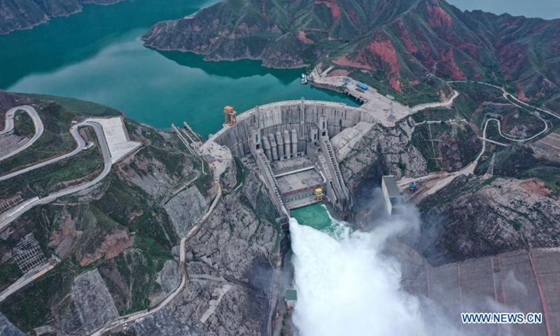 Aerial photo taken on July 9, 2020 shows water gushing out from the Lijiaxia Hydropower Station in northwest China's Qinghai Province. Qinghai is rich in solar and wind power. So far, the total installed renewable energy power generating capacity in Hainan Tibetan Autonomous Prefecture and Haixi Mongolian and Tibetan Autonomous Prefecture has reached 15 million kilowatts and 10 million kilowatts respectively. (Xinhua/Wu Gang)


