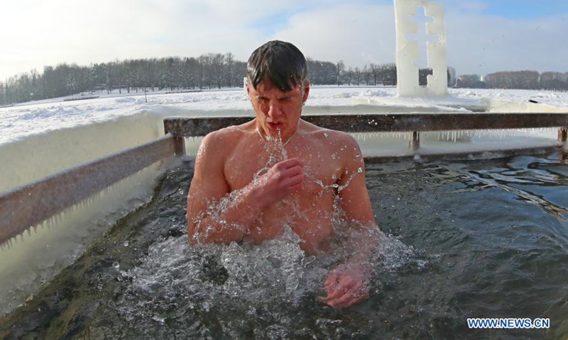 People bathe icy water during Orthodox Epiphany celebrations in Belarus ...