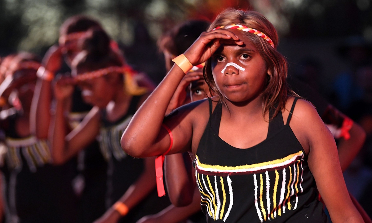 Indigenous Anangu perform a traditional dance during a ceremony marking the permanent ban on climbing Uluru, also known as Ayers Rock, at Uluru-Kata Tjuta National Park in Australia's Northern Territory on October 27, 2019. Photo: VCG