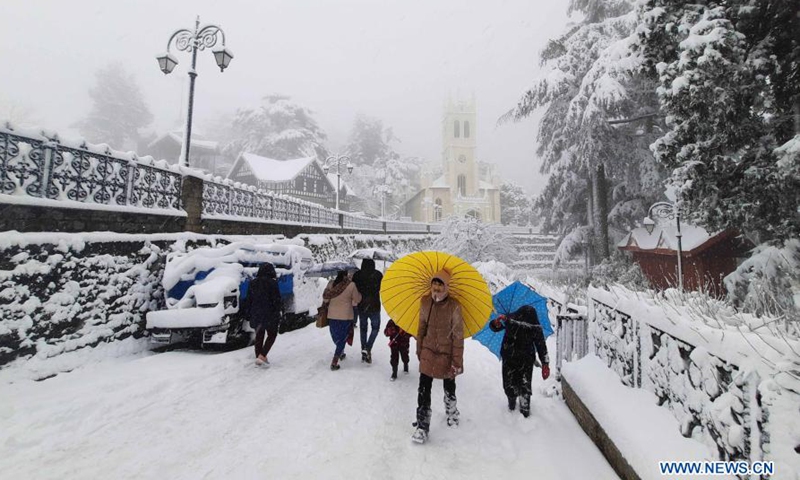 People play in snowfall, India - Global Times