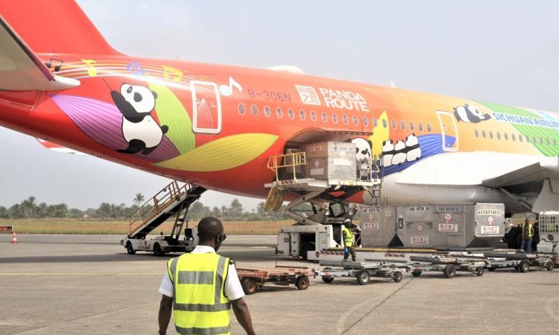 Workers unload the COVID-19 vaccine donated by China at an airport in Freetown, Sierra Leone, on Feb. 25, 2021. Sierra Leone on Thursday received a consignment of 200,000 doses of China's Sinopharm COVID-19 vaccine donated by China to support the country's vaccination campaign. (Photo by Abu/Xinhua)