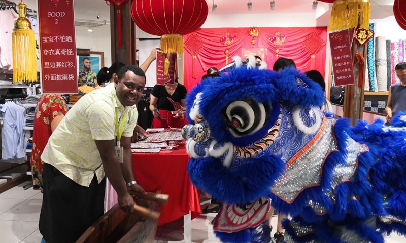 Shop assistants perform to celebrate the upcoming Chinese Lantern Festival at a chain store of Jack's of Fiji in Suva, Fiji, Feb. 25, 2021. (Xinhua/Zhang Yongxing) 