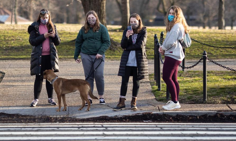 People tour the National Mall in Washington D.C., the United States, Feb. 27, 2021.Photo:Xinhua