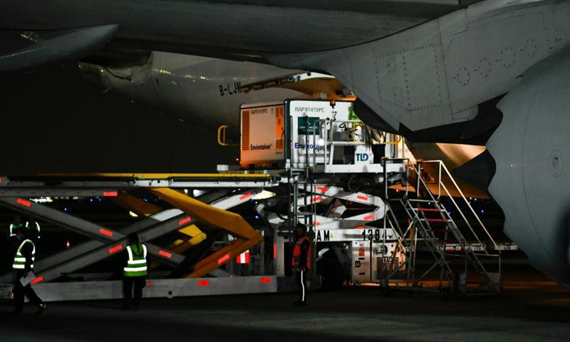 Staff members unload a temperature-controlled cargo container with COVID-19 vaccines from Chinese company Sinovac at Mexico International Airport in Mexico City, Mexico, Feb. 27, 2021. The second shipment of COVID-19 vaccines from Chinese company Sinovac arrived in Mexico City on Saturday.Photo:Xinhua