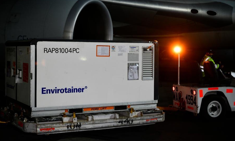 A staff member transfers a temperature-controlled cargo container with COVID-19 vaccines from Chinese company Sinovac at Mexico International Airport in Mexico City, Mexico, Feb. 27, 2021. The second shipment of COVID-19 vaccines from Chinese company Sinovac arrived in Mexico City on Saturday.Photo:Xinhua