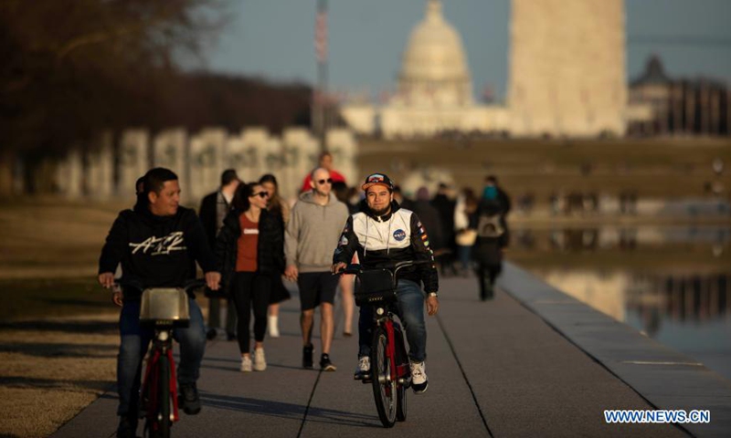 People tour the National Mall in Washington D.C., the United States, Feb. 27, 2021.Photo:Xinhua