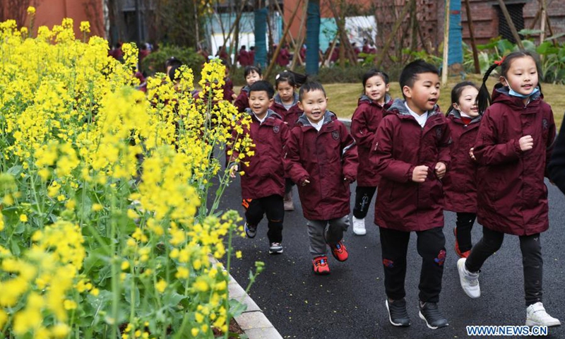 Students run in the campus on their first day of the new semester at a primary school in southwest China's Chongqing, March 1, 2021. Students returned to school for the spring semester on Monday in many parts of China amid coordinated epidemic control efforts.(Photo: Xinhua)