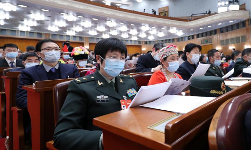 Chen Wei (front), a member of the 13th National Committee of the Chinese People's Political Consultative Conference (CPPCC), attends the opening meeting of the fourth session of the 13th CPPCC National Committee at the Great Hall of the People in Beijing, capital of China, March 4, 2021. (Xinhua/Wang Ye)


