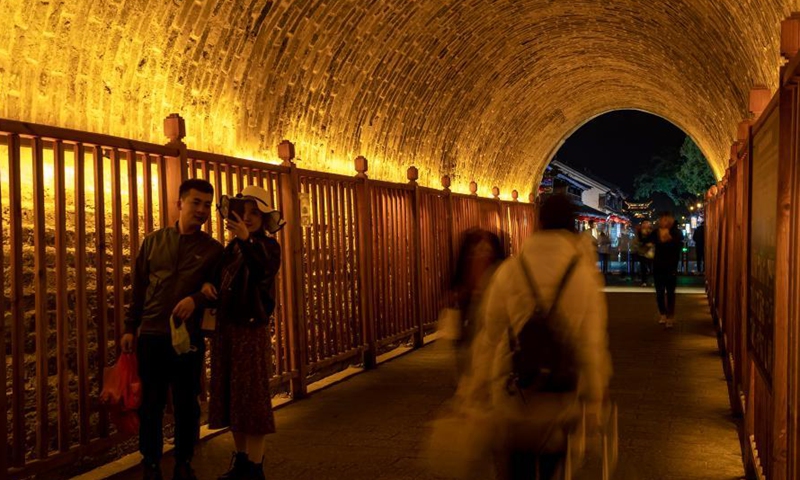 Tourists visit the old town of Dali, southwest China's Yunnan Province, March 3, 2021. The charming night view of the old town of Dali attracts a lot of tourists.Photo:Xinhua