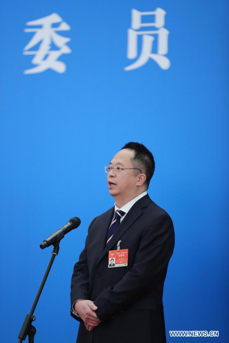 Zhou Hongyi, a member of the 13th National Committee of the Chinese People's Political Consultative Conference (CPPCC), is interviewed via video link ahead of the opening of the fourth session of the 13th CPPCC National Committee at the Great Hall of the People in Beijing, capital of China, March 4, 2021. (Xinhua/Li Muzi)