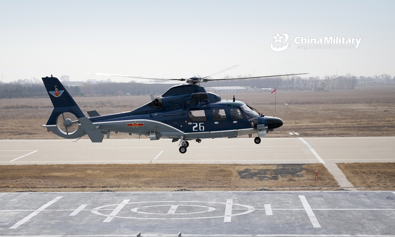 A ship-borne helicopter attached to a regiment under the PLA Naval Aviation University practice lift-off and landing on platform during a flight training course on February 20, 2021. Photo: China Military Online